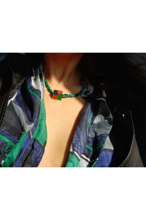 Green necklace with upcycled Givenchy pin