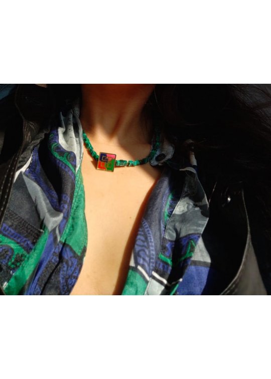 Green necklace with upcycled Givenchy pin