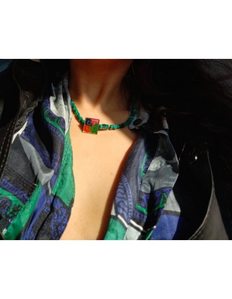 Green necklace with upcycled Givenchy pin