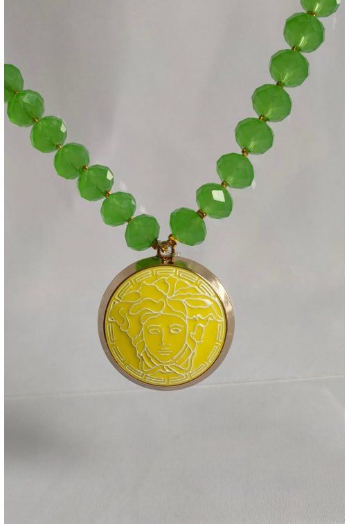 Green necklace with upcycled Versace pendant